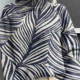 Dámský vzorovaný pletený rolákový svetr