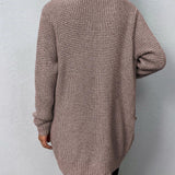 Růžový otevřený svetr